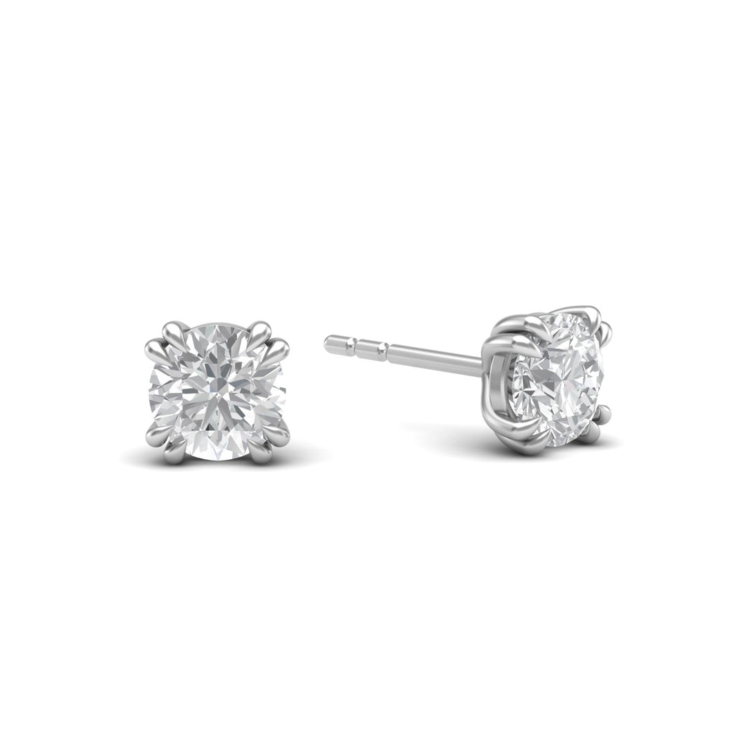 One-carat diamond stud earrings set in 18 karat white gold rhodium polished with classic four-prong claw settings, showcasing timeless elegance and brilliance.